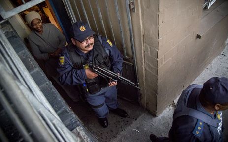 Police search the area of flats controlled by the Mongrels gang in Ottery for guns and drugs on 22 May 2015. Picture: Thomas Holders/EWN.